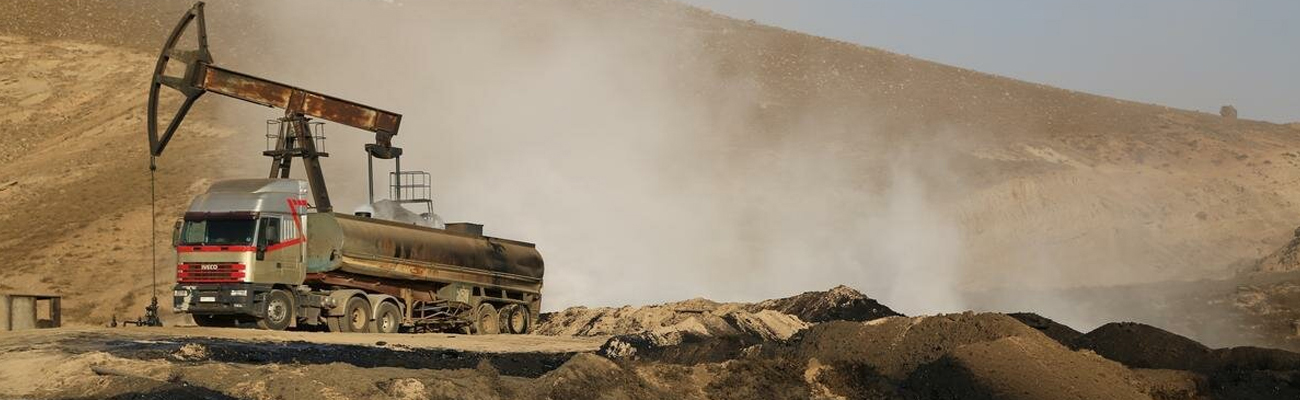 Syrian oil that is drilled from 1,200 oil wells in the town of Rumelan in Qamishli in northeastern Syria being wasted due to clashes between the "Islamic State" and "SDF" - 25 September 2014 (France Press)