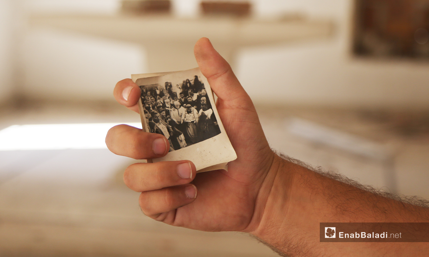 A priest in “Mar Georges” Church for the Greek Orthodox carries a picture of the church