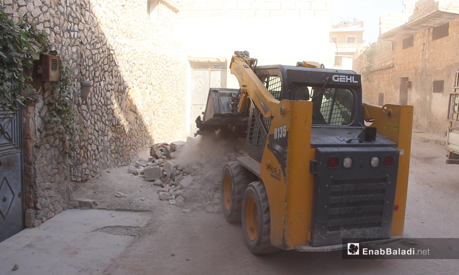 A rubble removal as a part of an initiative to revive the town of Atarib in the western countryside of Aleppo - October 2020 (Enab Baladi / Iyad Abdel Jawad)